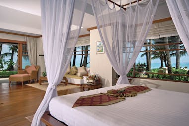 Santiburi Resort Thailand villa interior canopied bed lounge area modern décor