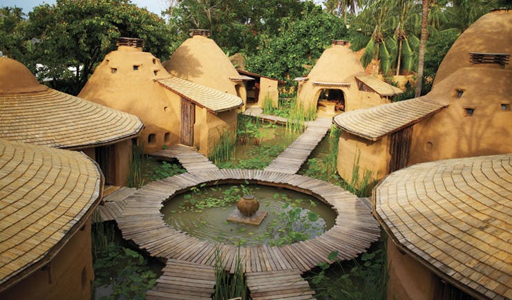 Six Senses Hua Hin Thailand Earthspa complex of traditional mud huts surrounding a lily pond