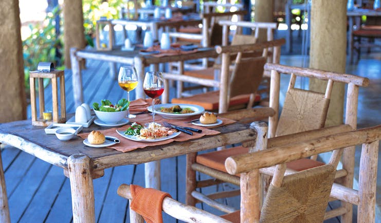 Six Senses Hua Hin Thailand The Beach restaurant wooden chairs tables deck area cuisine rustic