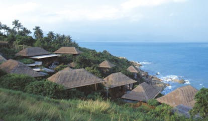 Six Senses Samui Thailand bungalow views thatched rooves palm forests ocean views
