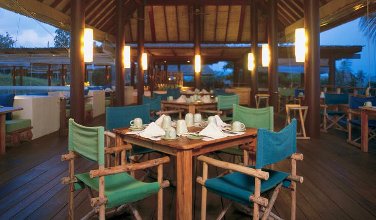 Six Senses Samui Thailand Dining on the Hill covered outdoor dining room night time