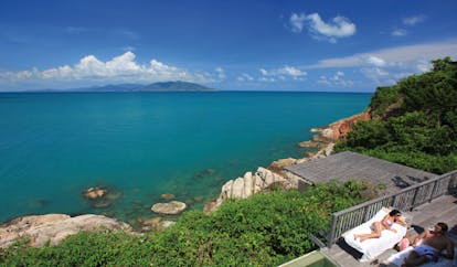 Six Senses Samui Thailand pool suite view couple on deck ocean and island view