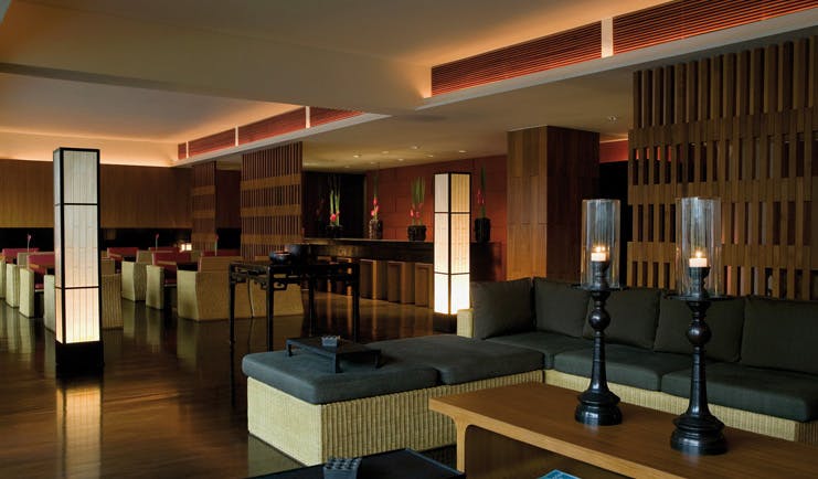 The Dhara Devi Thailand club lounge sofas armchairs candles modern minimalist decor