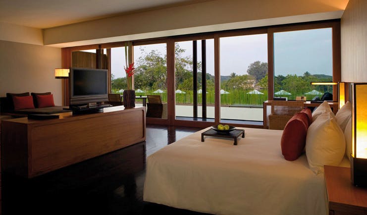 The Dhara Devi Thailand club suite bedroom sitting area panoramic window river view