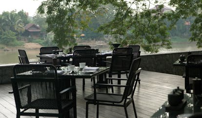 The Dhara Devi Thailand restaurant terrace deck outdoor dining area river view