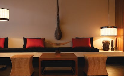 The Dhara Devi Thailand suite lounge modern minimalist decor wicker stools sofa