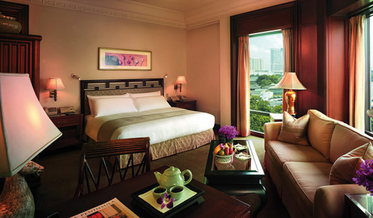 The Peninsula Bangkok Thailand deluxe bedroom lounge area tea setting city view