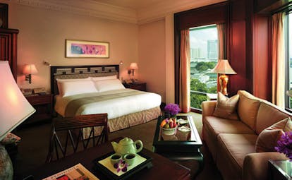 The Peninsula Bangkok Thailand deluxe bedroom lounge area tea setting city view