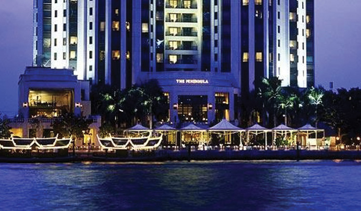 The Peninsula Bangkok Thailand exterior riverside skyscraper boats