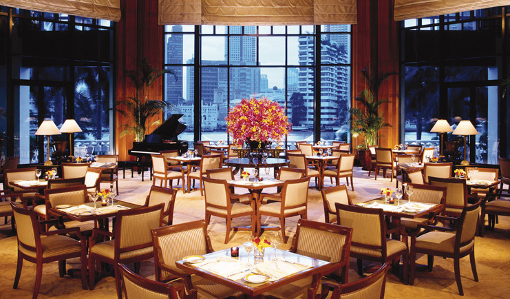 The Peninsula Bangkok Thailand indoor dining room panoramic riverside views
