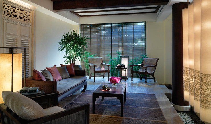 The Peninsula Bangkok Thailand lounge area with sofas and white columns