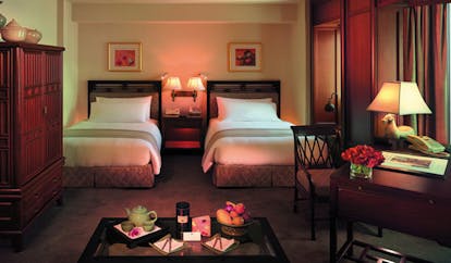 The Peninsula Bangkok Thailand superior twin bedroom classic decor sitting area tea tray