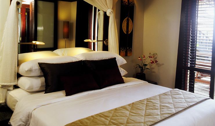 The Surin Phuket Thailand beach deluxe suite bedroom minimalist classic decor 