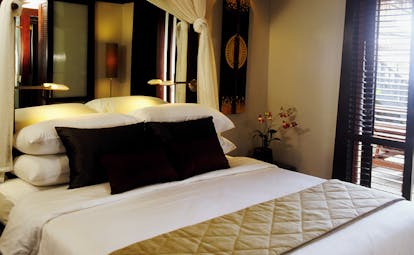 The Surin Phuket Thailand beach deluxe suite bedroom minimalist classic decor 