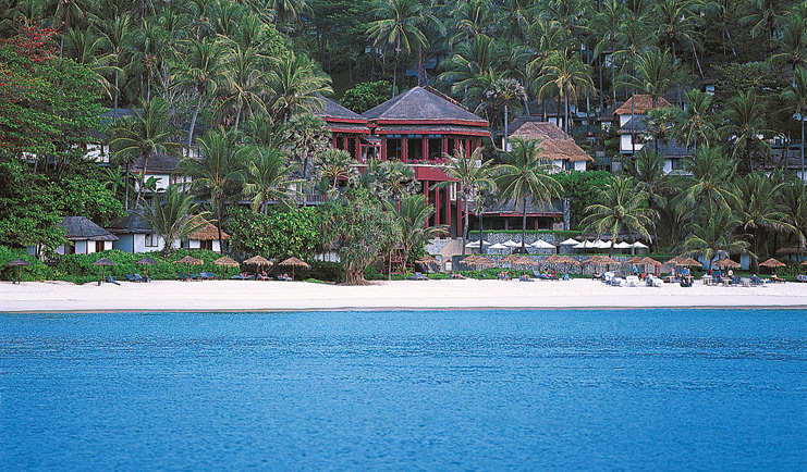 The Surin Phuket Thailand beach ocean palm trees hotel buildings