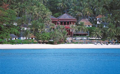 The Surin Phuket Thailand beach ocean palm trees hotel buildings