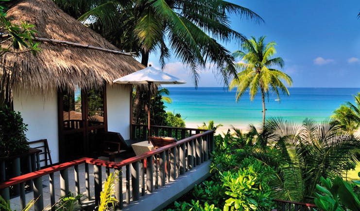 The Surin Phuket Thailand cottage sea view balcony palm trees 