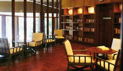 The Surin Phuket Thailand library bookshelves large windows seating areas
