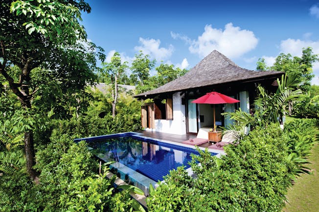 Vijitt Resort Thailand deluxe pool villa exterior private terrace and pool sun loungers umbrellas