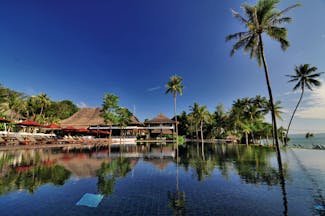 Vijitt Resort Thailand pool infinity pool sun loungers umbrellas overlooking beach