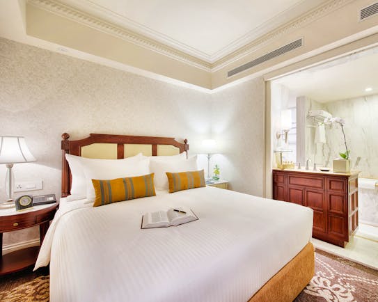 Apricot Hotel studio bedroom, king size bed, elegant decor, en suite shower room