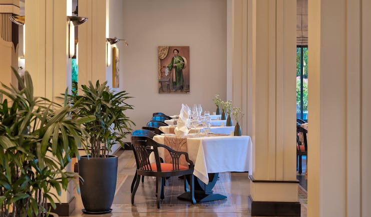 Azerai La Residence la parfum restarant, tables and chairs, elegant decor, plants, columns