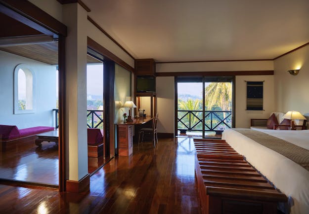 Belmond La Residence Phou Vao junior suite, traditional decor, balcony with mountain view