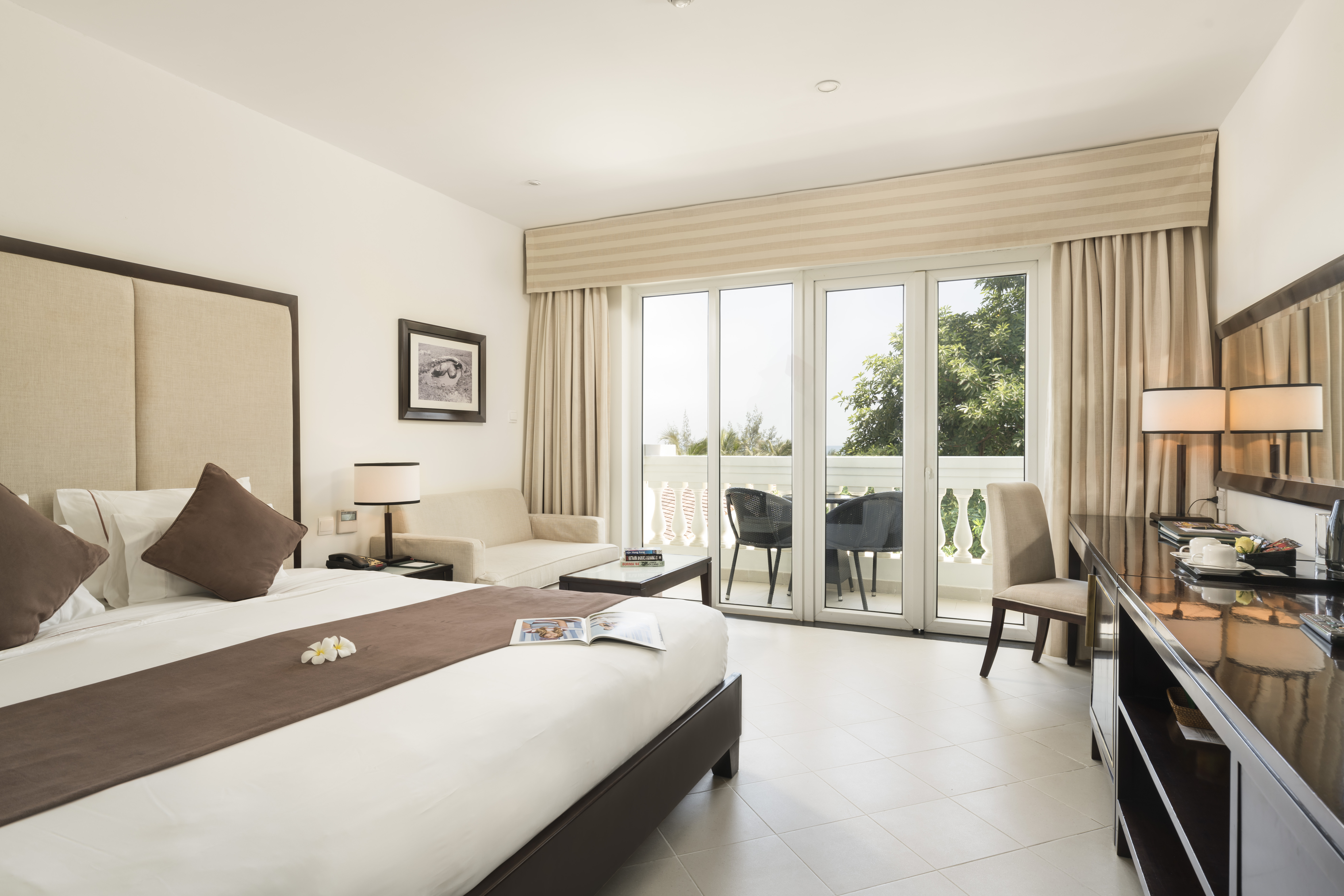 Boutique Hoi An superior room, double bed, desk, bright modern decor, french doors leading to balcony