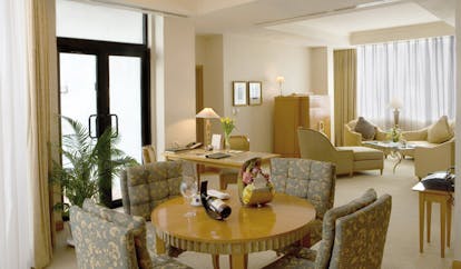 Caravelle Hotel Vietnam presidential suite lounge writing desk sofa armchair and dining area