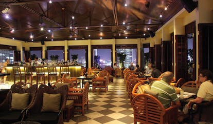Caravelle Hotel Vietnam Saigon bar indoor bar area chequerboard flooring classic decor