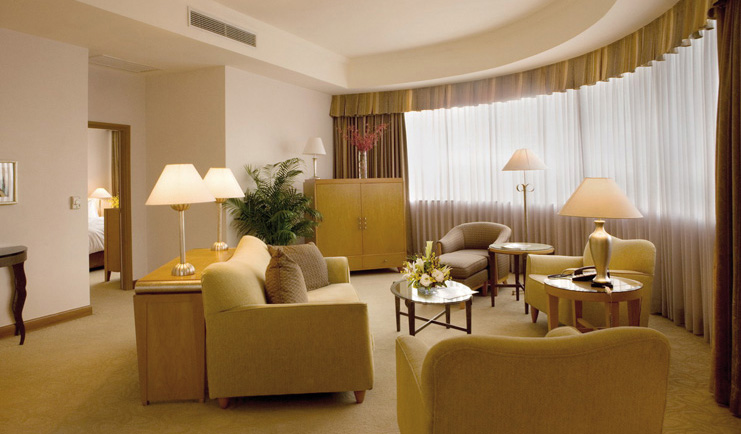 Caravelle Hotel Vietnam two bedroom lounge seating area bay window view of bedroom