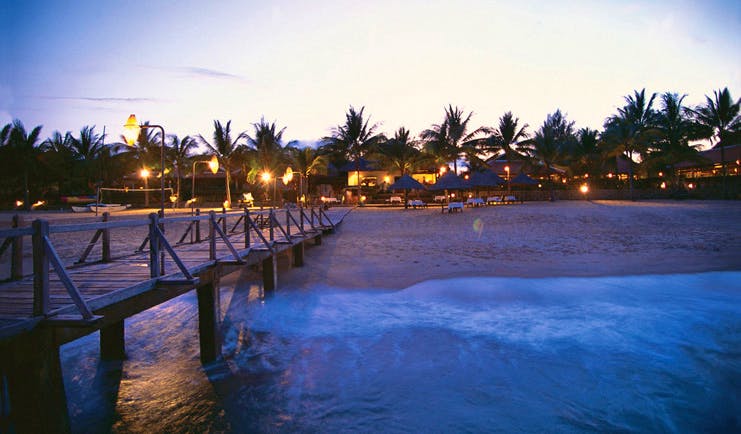 Evason Ana Mandara Resort Vietnam beach from jetty hotel view palm trees twilight
