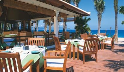Evason Ana Mandara Resort Vietnam beach restaurant outdoor dining area deck palm trees ocean view