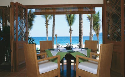 Evason Ana Mandara Resort Vietnam beach restaurant dining area with beach view palm trees