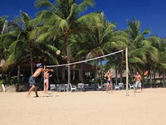 Evason Ana Mandara Resort Vietnam beach volleyball palm trees beach seating area