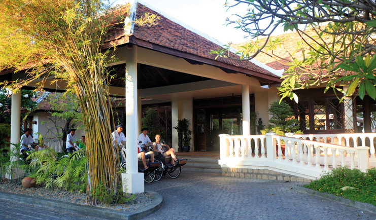 Evason Ana Mandara Resort Vietnam hotel entrance couple embarking on cyclo tour