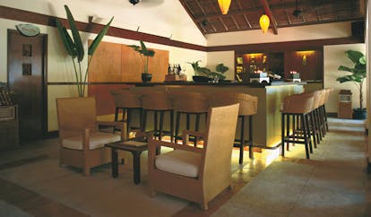 Evason Ana Mandara Resort Vietnam veranda bar indoor bar with stools and chairs modern decor