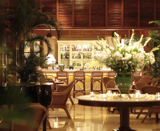Furama Resort Vietnam bar indoor seating area authentic décor fresh flowers