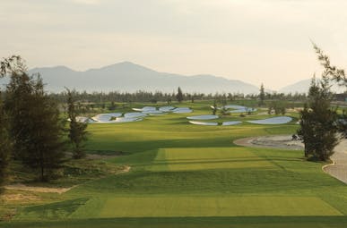 Furama Resort Vietnam golf course trees mountains in distance