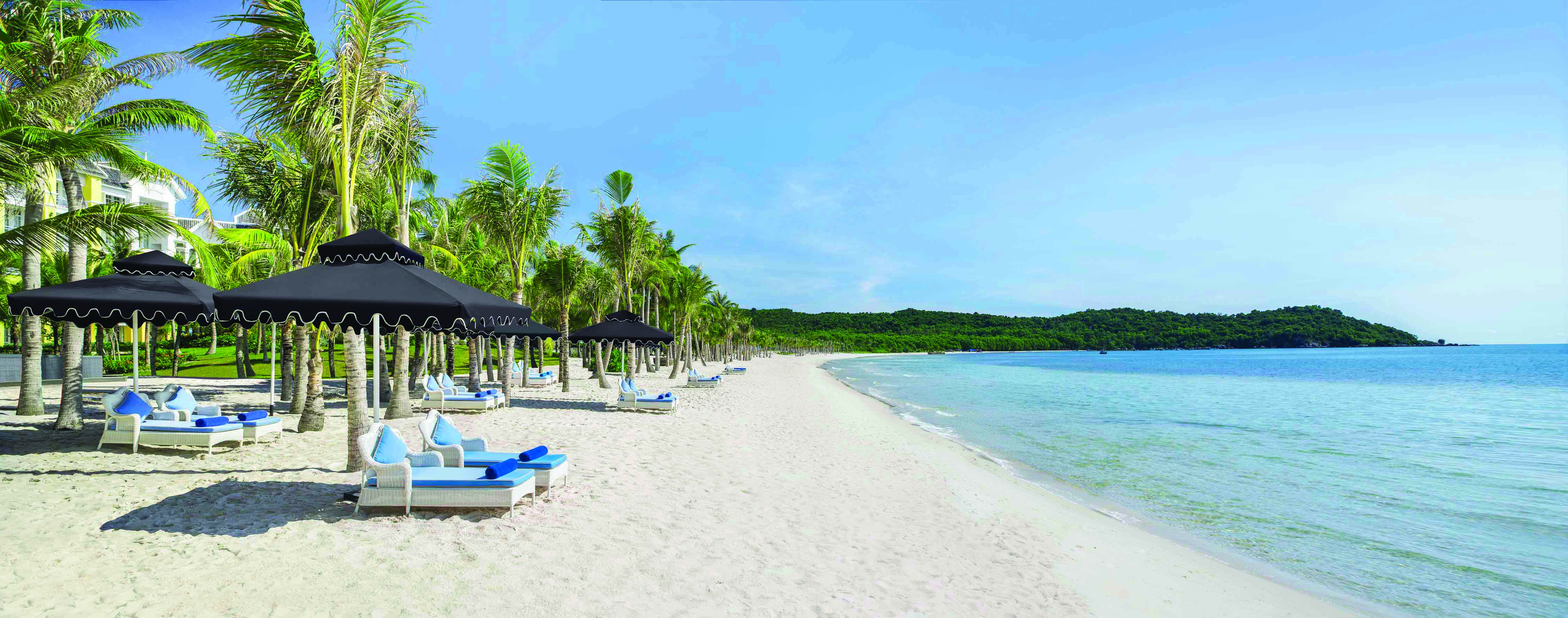 JW Marriott Phu Quoc Vietnam beach white sand sun loungers umbrellas sea palm trees
