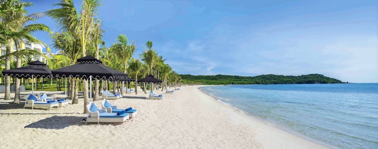JW Marriott Phu Quoc Vietnam beach white sand sun loungers umbrellas sea palm trees