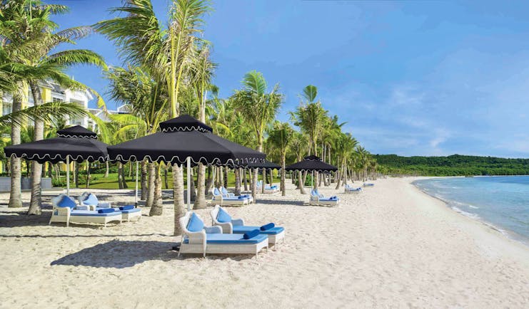 JW Marriott Phu Quoc Vietnam beach white sand sun loungers umbrellas sea palm trees