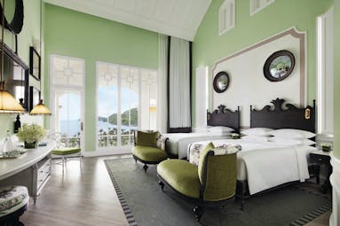 JW Marriott Phu Quoc Vietnam emerald bay view guestroom bed chairs elegant décor private terrace
