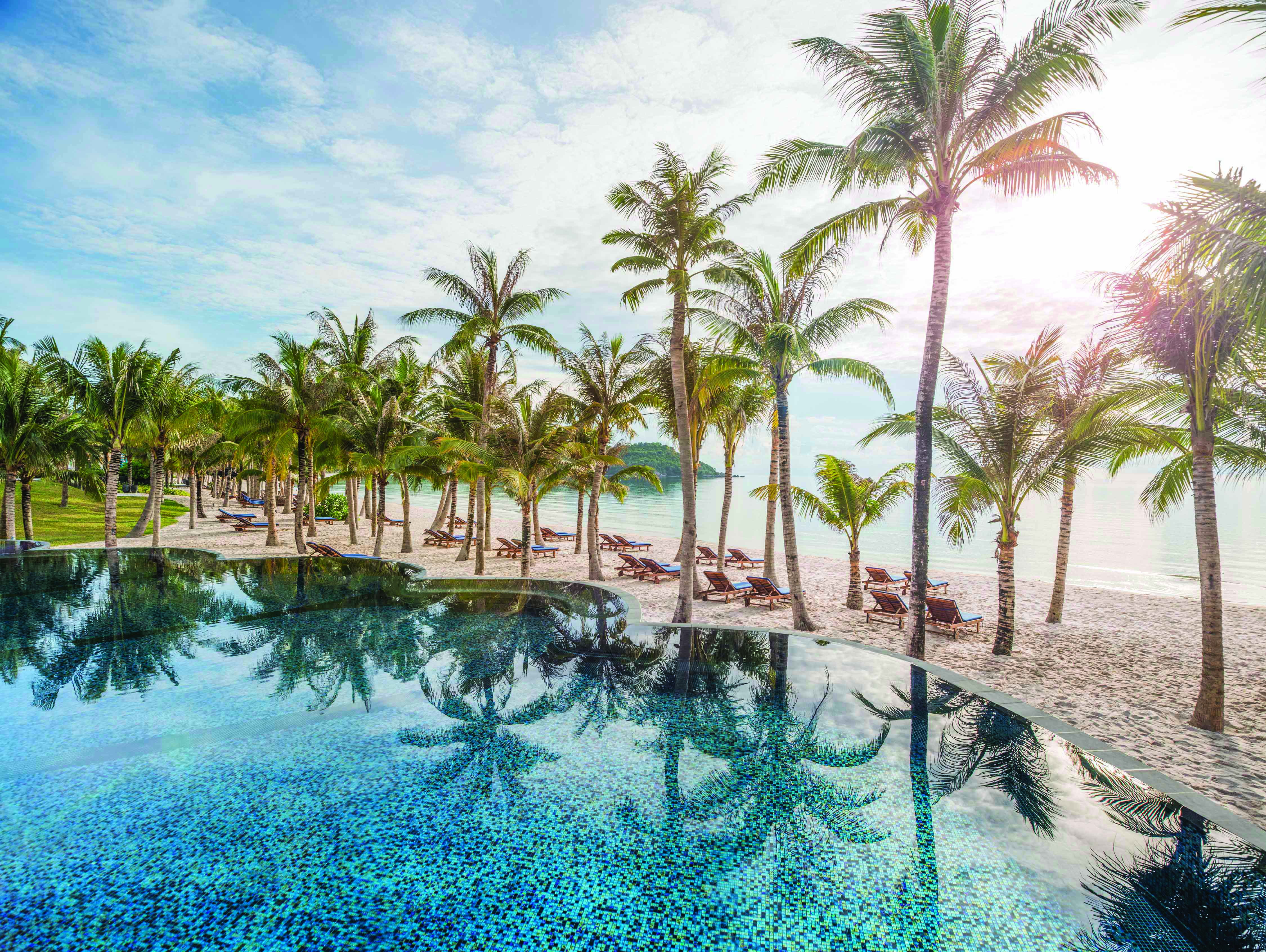 JW Marriott Phu Quoc Vietnam pool overlooking beach sand sea palm trees
