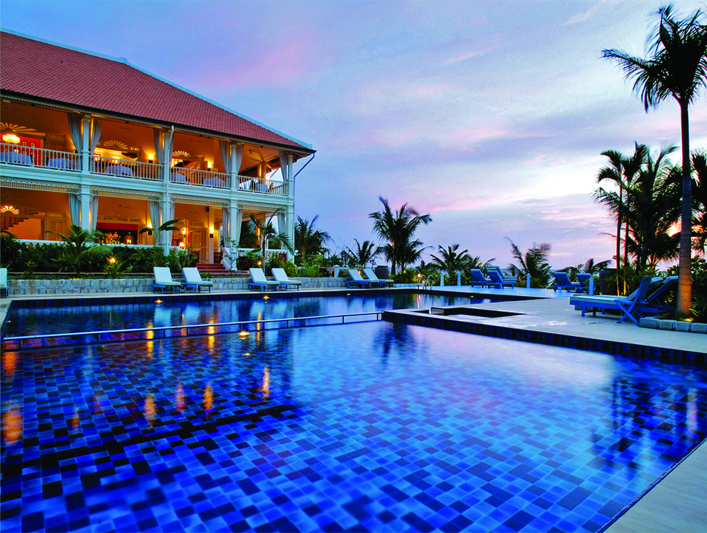 La Veranda Vietnam pool sun loungers palm trees hotel building