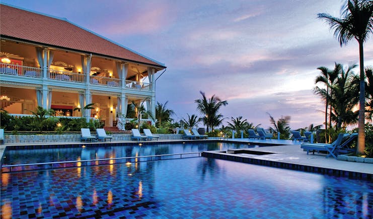 La Veranda Vietnam pool sun loungers palm trees hotel building