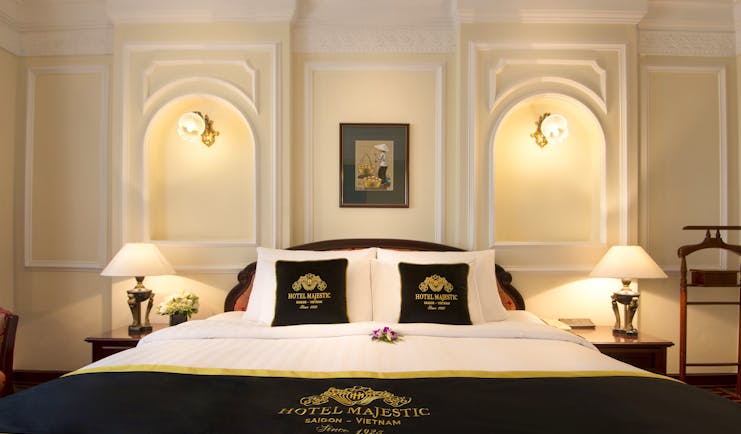 Majestic Hotel Saigon deluxe room, double bed, ornate decor