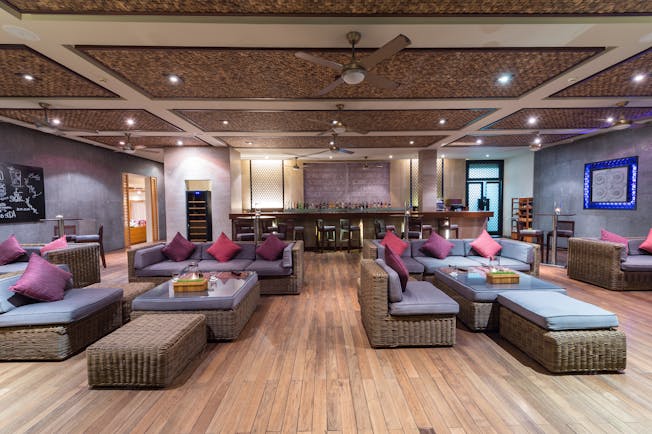 Mia Nha Trang Resort bar, indoor wicker sofas and armchairs, bright modern decor,