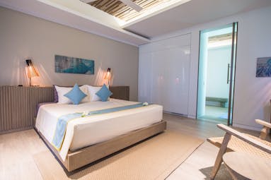 Mia Nha Trang Resort condo bedroom, double bed, chair, colourful modern decor