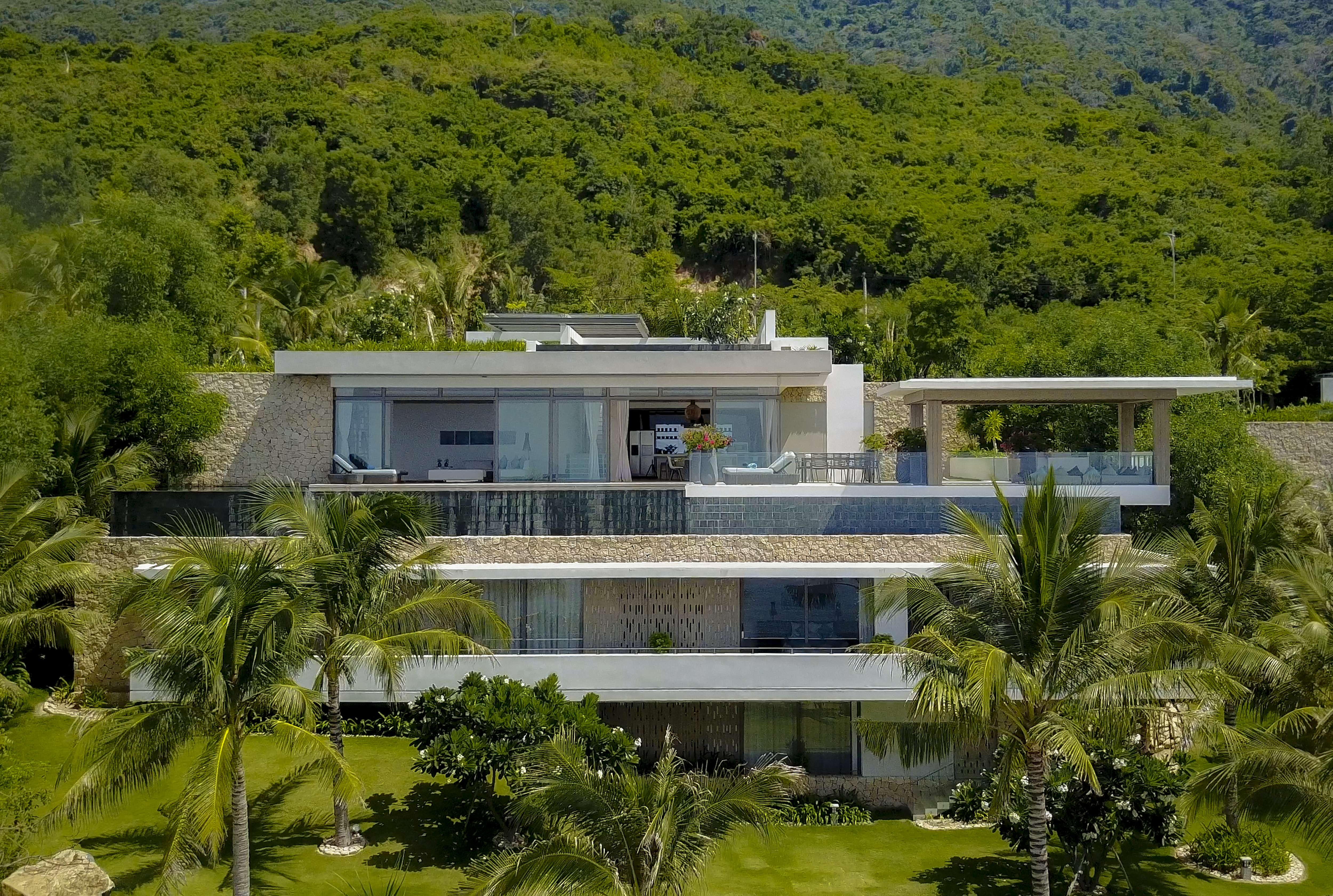 Mia Nha Trang Resort five bedroom villa exterior, contemporary architecture, balconies, tropical forest in background